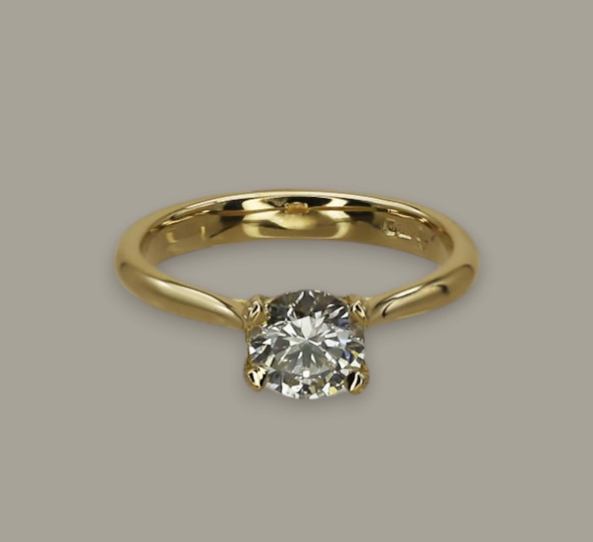 0.72ct Round Brilliant Cut Diamond Solitaire Engagement Ring in 18ct Yellow Gold with Pear Diamond Detail - Neil Rayment Goldsmiths