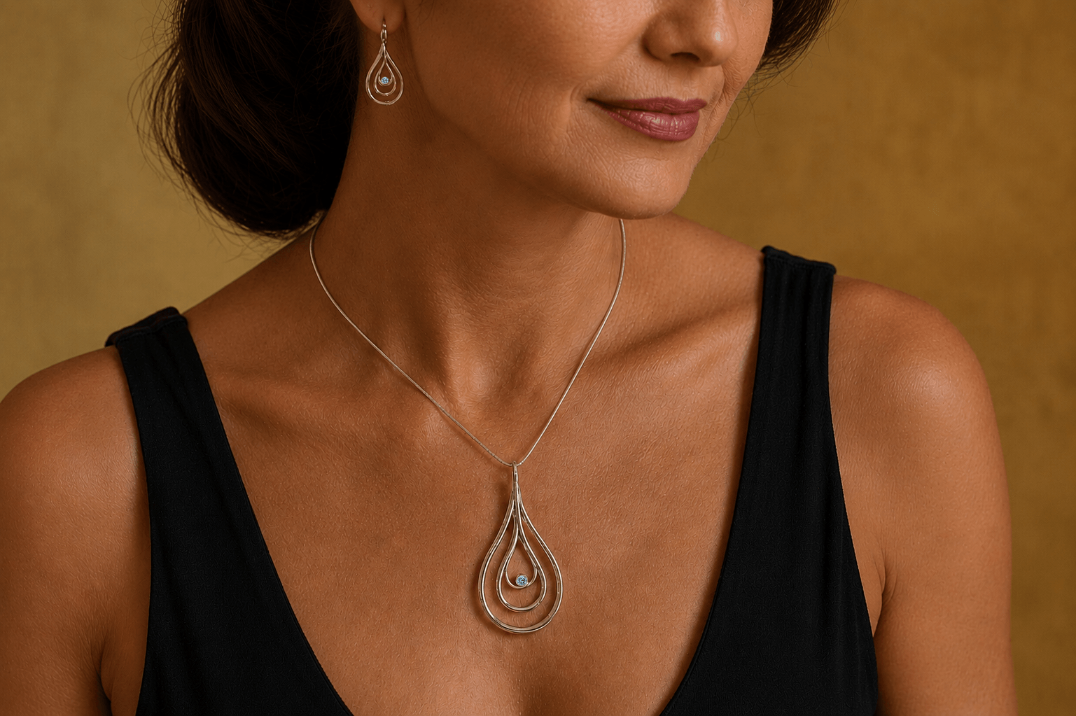Carreg Las large silver blue diamond pendant necklace worn with matching earrings