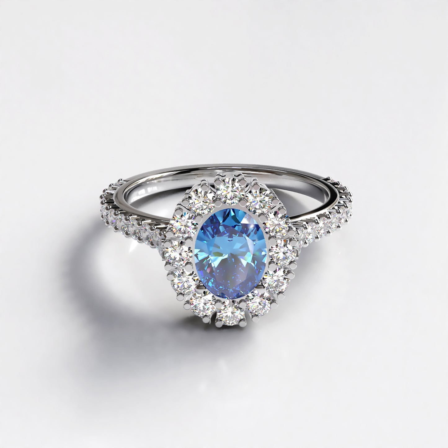 Vintage Halo: Platinum Engagement Ring with 1ct Sapphire Centre Stone and Diamond Halo