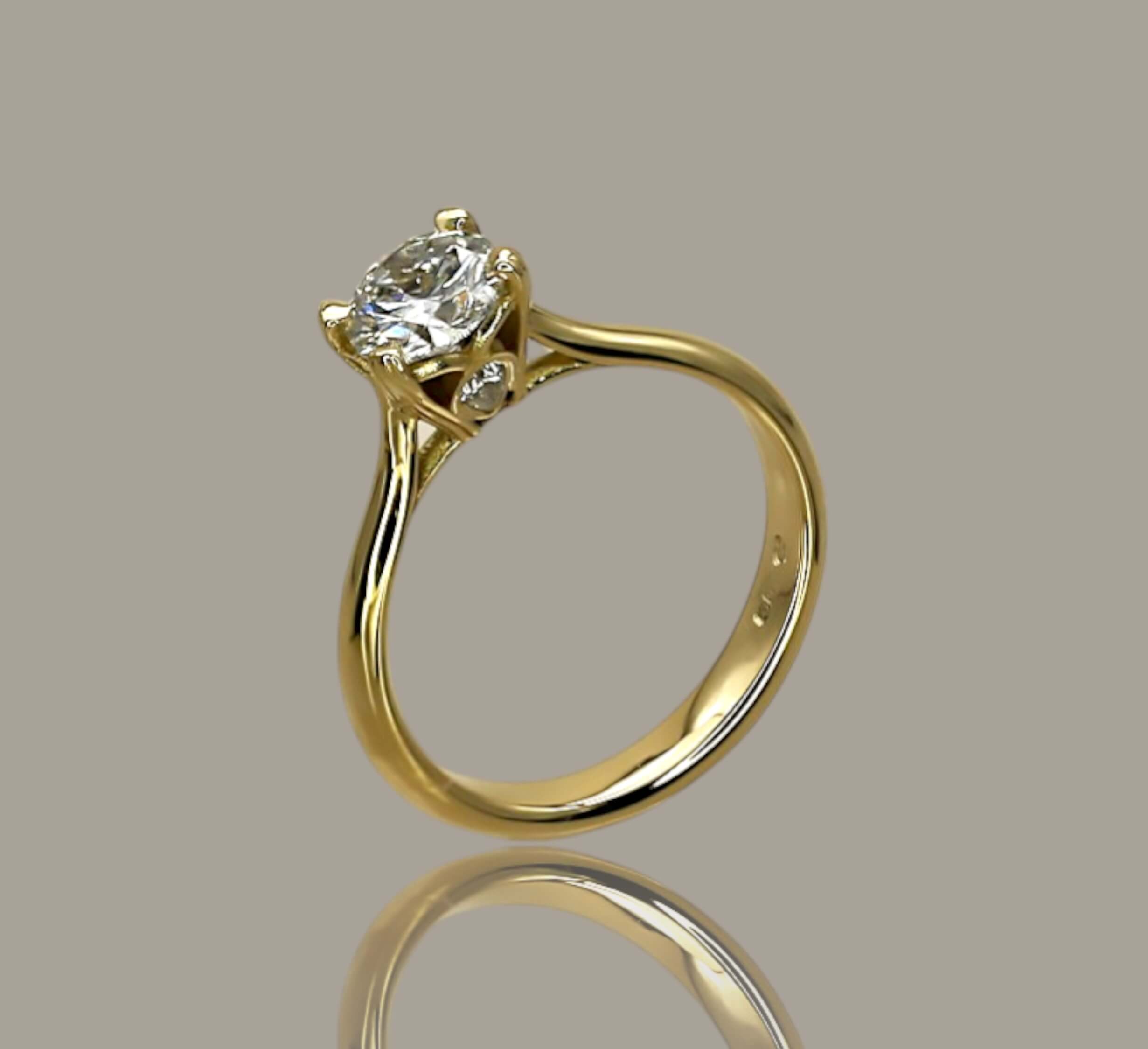 0.72ct Round Brilliant Cut Diamond Solitaire Engagement Ring in 18ct Yellow Gold with Pear Diamond Detail - Neil Rayment Goldsmiths