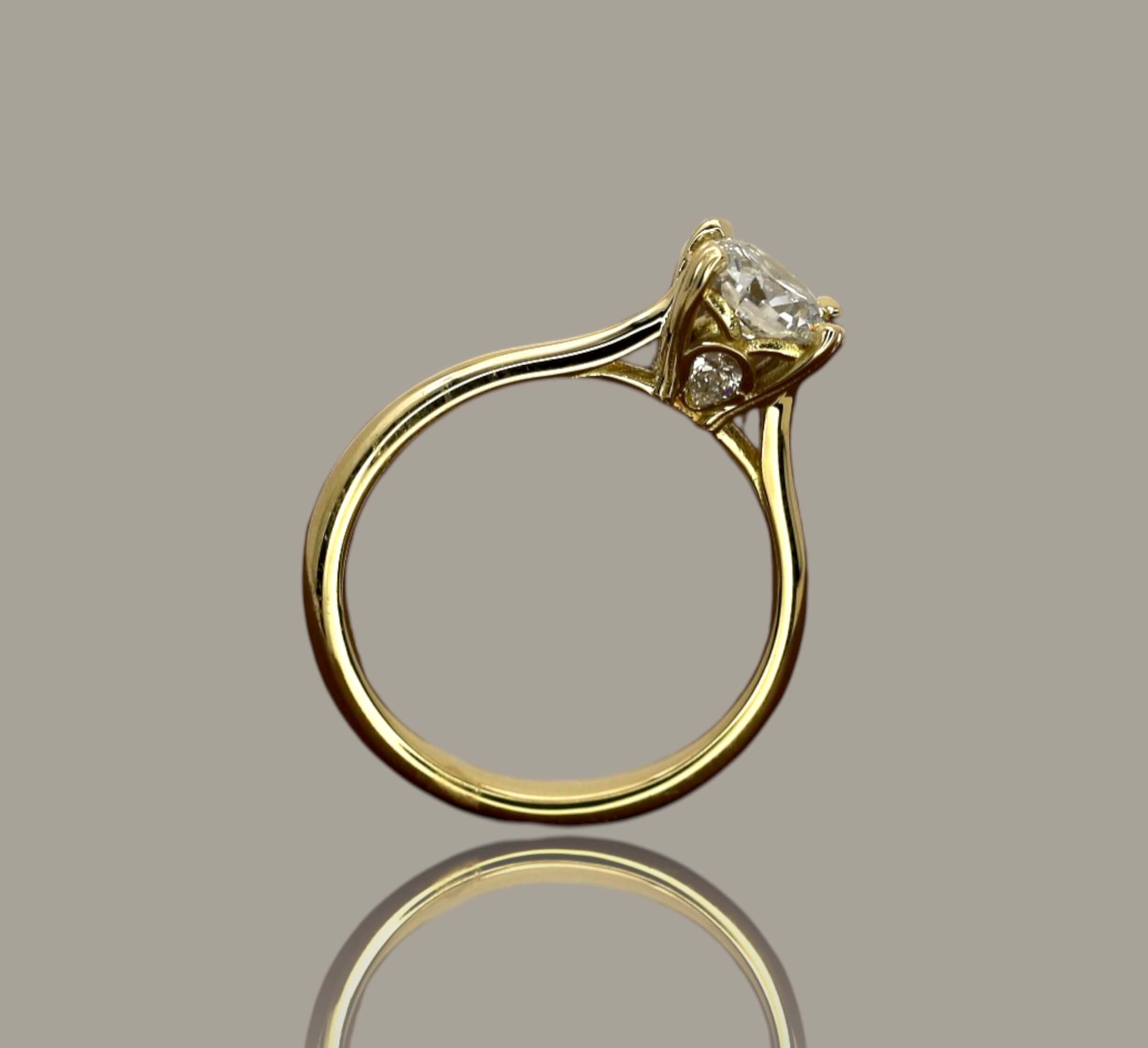 0.72ct Round Brilliant Cut Diamond Solitaire Engagement Ring in 18ct Yellow Gold with Pear Diamond Detail - Neil Rayment Goldsmiths