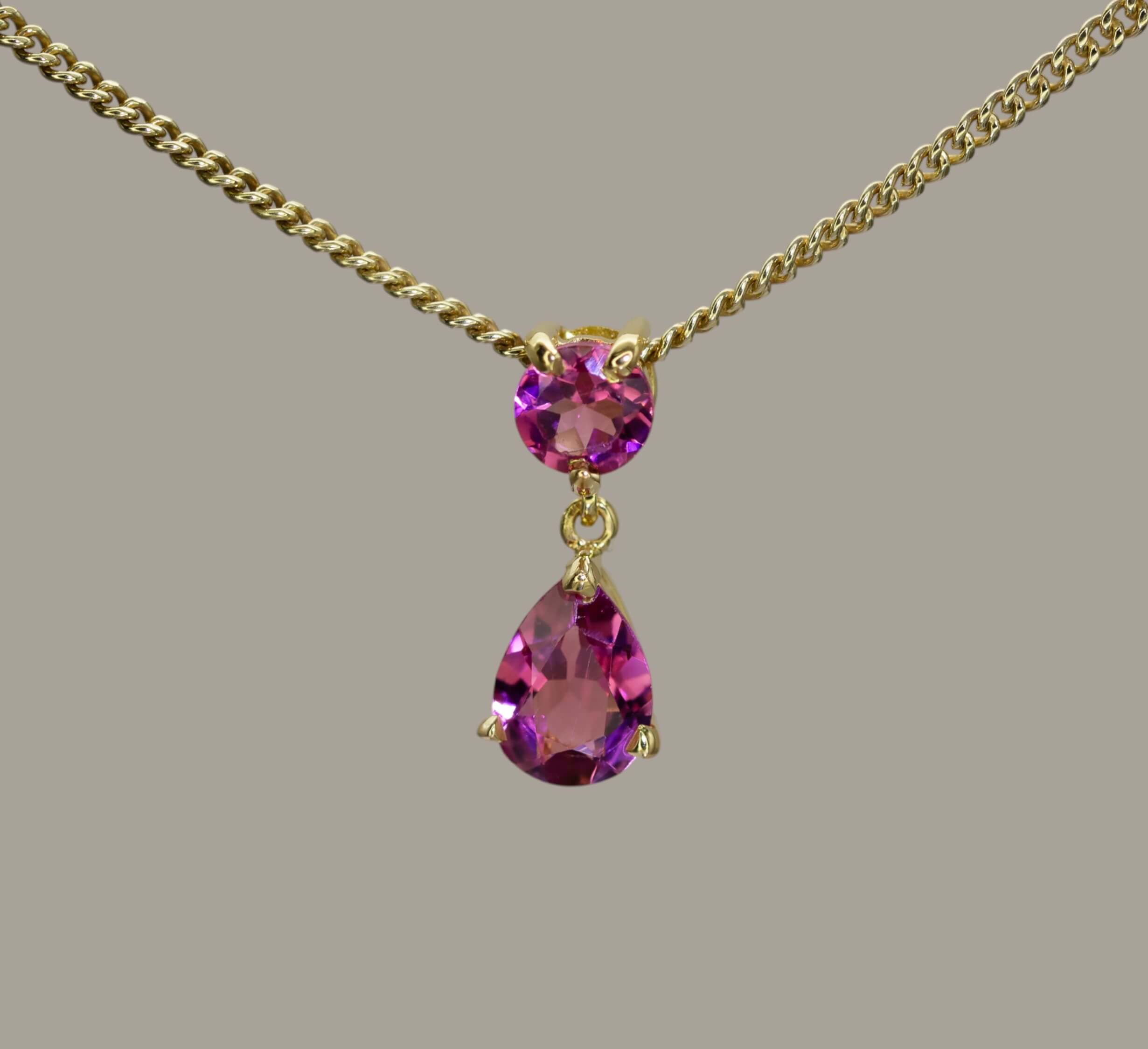 Claw set round and pear shaped tourmaline Pendant (18ct Yellow)