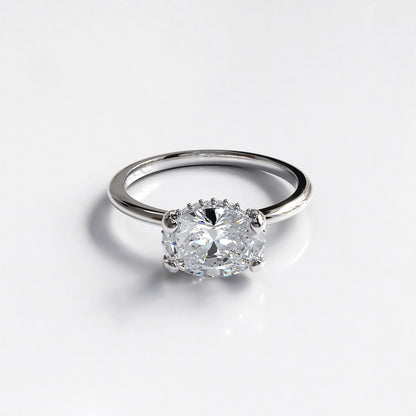 Delicate Poise: 18ct Yellow gold oval-cut diamond engagement ring with Platinum head - Neil Rayment Goldsmiths