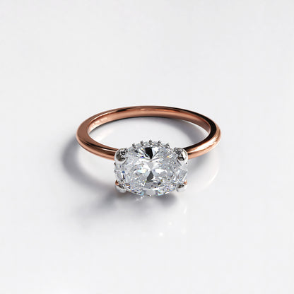 Delicate Poise: 18ct Yellow gold oval-cut diamond engagement ring with Platinum head