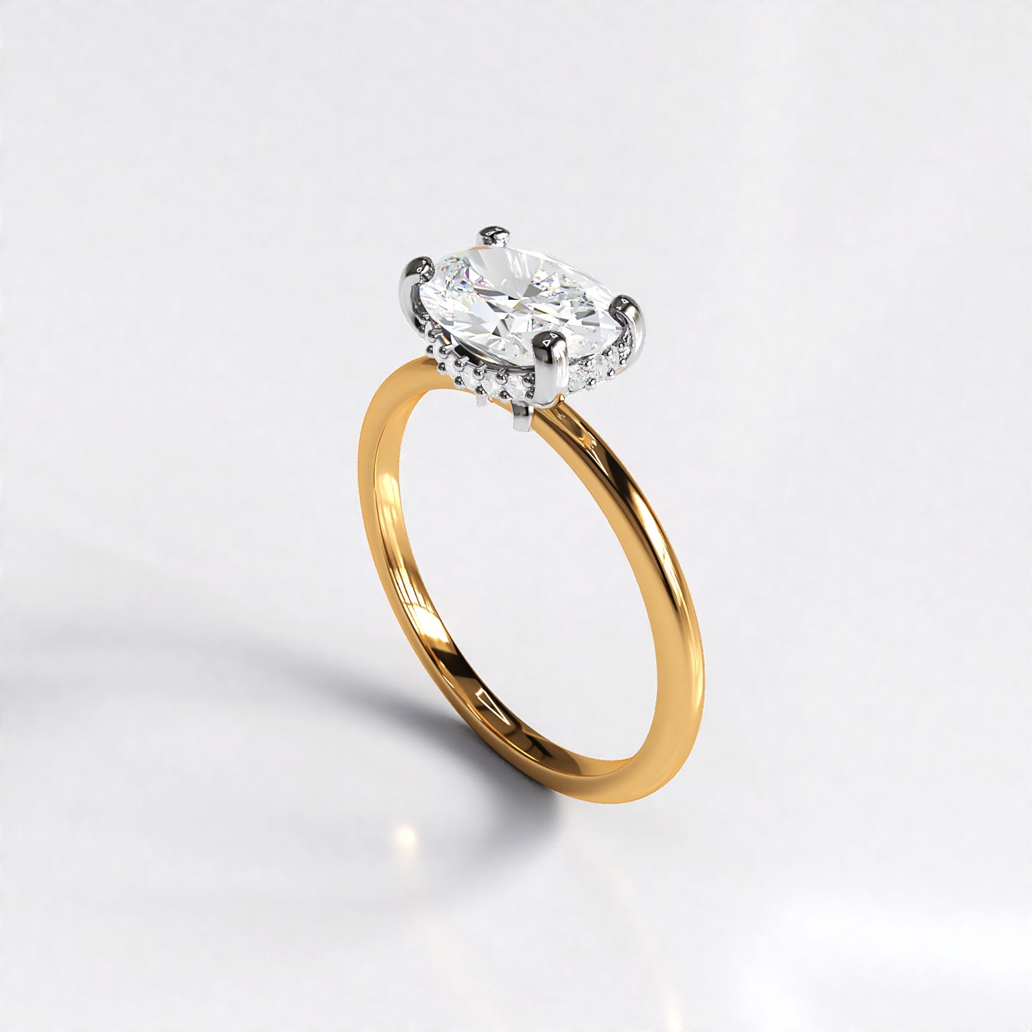 Delicate Poise: 18ct Yellow gold oval-cut diamond engagement ring with Platinum head