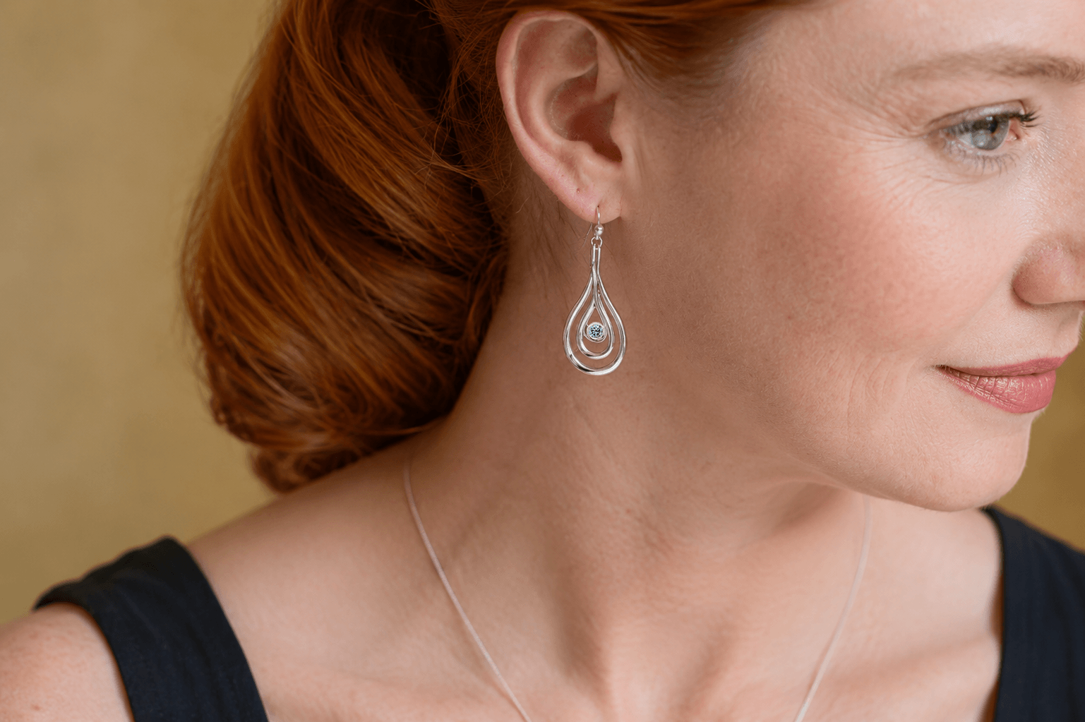 Carreg Las sterling silver blue diamond drop earrings worn on ear