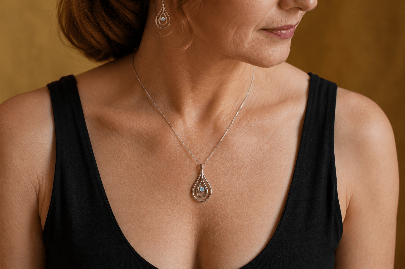 Carreg Las small sterling silver blue diamond pendant necklace worn with black dress