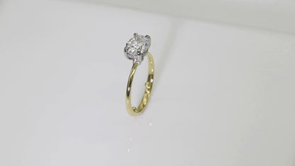 Delicate Poise: 18ct Yellow gold oval-cut diamond engagement ring with Platinum head