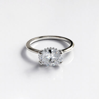 Delicate Poise: 18ct Yellow gold oval-cut diamond engagement ring with Platinum head